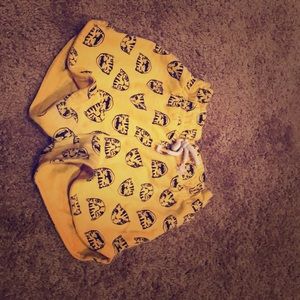 Gold shorts, designed with black cheetah faces.